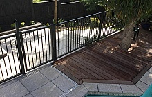 Terrazzo Stoneworks Honed Pavers with timber deck